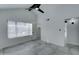 Spacious bedroom with grey flooring, large window, and private closet at 10115 E Mountain View Rd # 2022, Scottsdale, AZ 85258