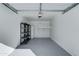 Garage with shelving, mini-fridge, and epoxy flooring at 10115 E Mountain View Rd # 2022, Scottsdale, AZ 85258