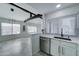 Modern kitchen features white cabinets, stainless steel appliances, and an open layout at 10115 E Mountain View Rd # 2022, Scottsdale, AZ 85258
