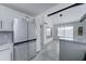 Modern kitchen with stainless steel appliances and white cabinets at 10115 E Mountain View Rd # 2022, Scottsdale, AZ 85258