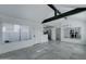 Open concept living area with kitchen and exposed beams at 10115 E Mountain View Rd # 2022, Scottsdale, AZ 85258