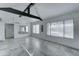 Open concept living room with kitchen and exposed beams at 10115 E Mountain View Rd # 2022, Scottsdale, AZ 85258
