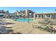 Community pool with lounge chairs and patio area at 10115 E Mountain View Rd # 2022, Scottsdale, AZ 85258