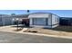 Nice manufactured home with carport and small yard at 10951 N 91St Ave # 127, Peoria, AZ 85345