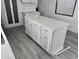 Modern white kitchen island with quartz countertop and sleek hardware at 10951 N 91St Ave # 127, Peoria, AZ 85345