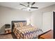 Guest bedroom with ceiling fan and closet at 11192 N 109Th Pl, Scottsdale, AZ 85259