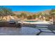Stunning backyard with a pool, waterfall, and built-in grill at 12159 N 120Th Way, Scottsdale, AZ 85259