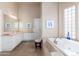 Spa-like bathroom with double vanity and soaking tub at 12159 N 120Th Way, Scottsdale, AZ 85259