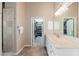Clean bathroom with shower, vanity, and walk-in closet at 12159 N 120Th Way, Scottsdale, AZ 85259