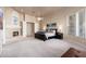 Bright bedroom featuring a fireplace and large windows at 12159 N 120Th Way, Scottsdale, AZ 85259