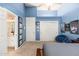 Blue-walled bedroom with ensuite bathroom and sitting area at 12159 N 120Th Way, Scottsdale, AZ 85259