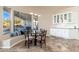 Breakfast nook with a built-in window seat and view of the backyard at 12159 N 120Th Way, Scottsdale, AZ 85259