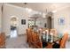 Spacious dining room with glass table and view into game room at 12159 N 120Th Way, Scottsdale, AZ 85259