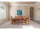 Bright dining room with a large glass table and wood chairs at 12159 N 120Th Way, Scottsdale, AZ 85259