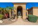 Inviting front entrance with arched entryway and landscaping at 12159 N 120Th Way, Scottsdale, AZ 85259