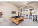 Game room featuring a pool table and access to a backyard patio at 12159 N 120Th Way, Scottsdale, AZ 85259