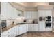 Modern kitchen with white cabinets, granite countertops, and stainless steel appliances at 12159 N 120Th Way, Scottsdale, AZ 85259