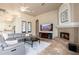 Living area featuring comfortable seating and a fireplace at 12159 N 120Th Way, Scottsdale, AZ 85259