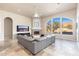 Living room with a cozy fireplace and large windows at 12159 N 120Th Way, Scottsdale, AZ 85259