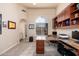Home office with built-in desk and cabinets at 12159 N 120Th Way, Scottsdale, AZ 85259