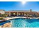 Luxury backyard oasis featuring a large pool, spa, and rock waterfall at 12159 N 120Th Way, Scottsdale, AZ 85259