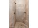 Large walk-in shower with tile surround and built-in seat at 12159 N 120Th Way, Scottsdale, AZ 85259