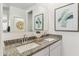 Double vanity bathroom with granite countertops and walk-in closet at 1216 S Mullberry St, Florence, AZ 85132