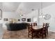 Charming dining room with a rustic wooden table and chandelier at 12701 W Avalon Dr, Avondale, AZ 85392