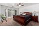 Main bedroom with plush carpeting and sliding glass door to patio at 12701 W Avalon Dr, Avondale, AZ 85392