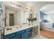 Beautiful bathroom with double sinks, white countertop and updated fixtures at 13022 W Surrey Ave, El Mirage, AZ 85335