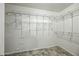 Walk-in closet featuring custom metal shelving and neutral walls at 13022 W Surrey Ave, El Mirage, AZ 85335
