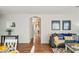 Living room features natural light, hardwood floors, and modern decor at 13022 W Surrey Ave, El Mirage, AZ 85335