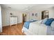 Spacious main bedroom featuring hardwood floors and an entrance to the bath and walk-in closet at 13022 W Surrey Ave, El Mirage, AZ 85335
