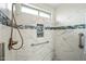 Main bathroom featuring a new walk-in shower and a handheld shower head at 13022 W Surrey Ave, El Mirage, AZ 85335