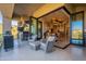 Outdoor patio with comfortable seating and a full kitchen area for seamless indoor-outdoor living at 13412 N 14Th Pl, Phoenix, AZ 85022