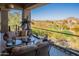 Inviting covered patio with comfortable seating and picturesque golf course views at 13412 N 14Th Pl, Phoenix, AZ 85022