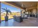 Relaxing covered balcony features stylish seating and a beautiful view of the desert landscape at 13412 N 14Th Pl, Phoenix, AZ 85022