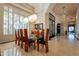 Formal dining room features modern light fixture and large shuttered windows at 13412 N 14Th Pl, Phoenix, AZ 85022