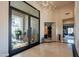 Light filled foyer with chandelier and clear view into the front courtyard at 13412 N 14Th Pl, Phoenix, AZ 85022