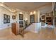 Spacious foyer featuring staircase with glass railing, modern chandelier, and views into the living spaces at 13412 N 14Th Pl, Phoenix, AZ 85022