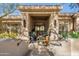 Grand front entrance with tile steps, fountain, and well-manicured shrubbery at 13412 N 14Th Pl, Phoenix, AZ 85022