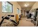 Spacious home gym with carpeted floors, mirrored walls, and an abundance of weight training machines at 13412 N 14Th Pl, Phoenix, AZ 85022