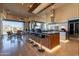 Modern kitchen with a large island, stainless steel appliances, and a view of the outdoor patio at 13412 N 14Th Pl, Phoenix, AZ 85022