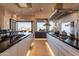 Open concept kitchen with stainless steel appliances, a center island, and sleek cabinetry at 13412 N 14Th Pl, Phoenix, AZ 85022