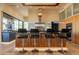 Modern kitchen island with seating, stainless steel appliances, and sleek cabinetry at 13412 N 14Th Pl, Phoenix, AZ 85022