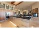 Gourmet kitchen with stainless steel appliances, black countertop, and sleek cabinetry at 13412 N 14Th Pl, Phoenix, AZ 85022