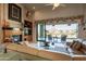 Bright living room boasts a fireplace, built-ins, and gorgeous mountain views at 13412 N 14Th Pl, Phoenix, AZ 85022