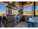 Outdoor kitchen featuring stainless steel grill, expansive counter space, sink, storage, and stunning views at 13412 N 14Th Pl, Phoenix, AZ 85022