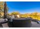 Inviting outdoor seating area with comfortable furniture, umbrella, and beautiful mountain views at 13412 N 14Th Pl, Phoenix, AZ 85022