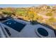 Aerial view features a dark swimming pool and hot tub overlooking the community golf course at 13412 N 14Th Pl, Phoenix, AZ 85022